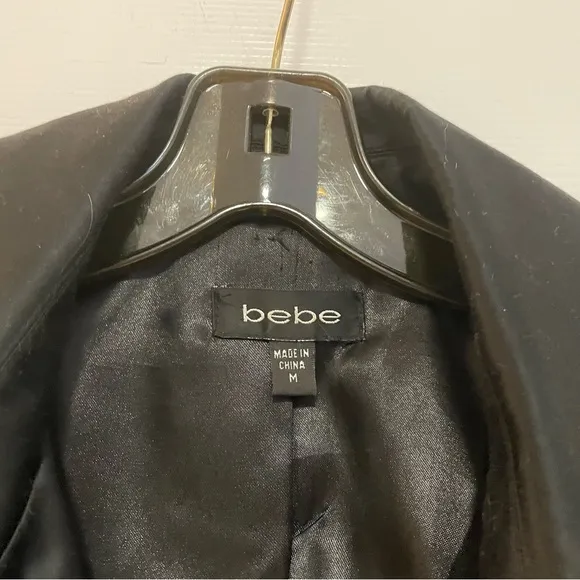 BEBE Black Belted Trench Coat Super Unique and Versatile Size Medium.